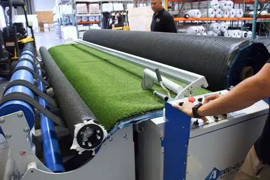 Accu-Cut Machine Rolling out Artificial Turf Accu-Cut Machine Rolling out Artificial Turf